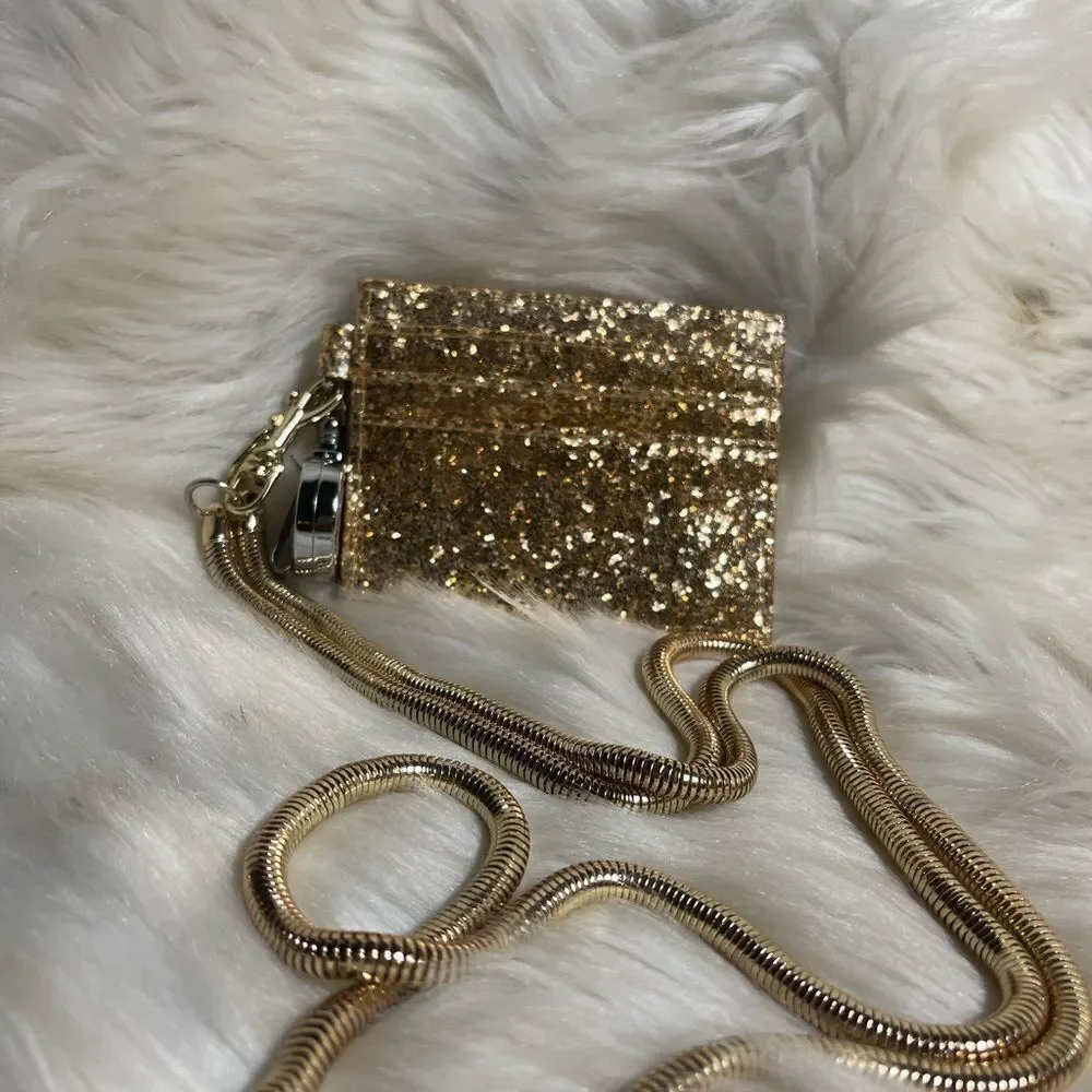 Retractable ID holder gold glitter with detachable gold tone chain .